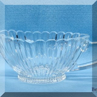 G07. Pressed glass gravy boat. Small chip. 3” x 4” x 7” chipped on side. - $4